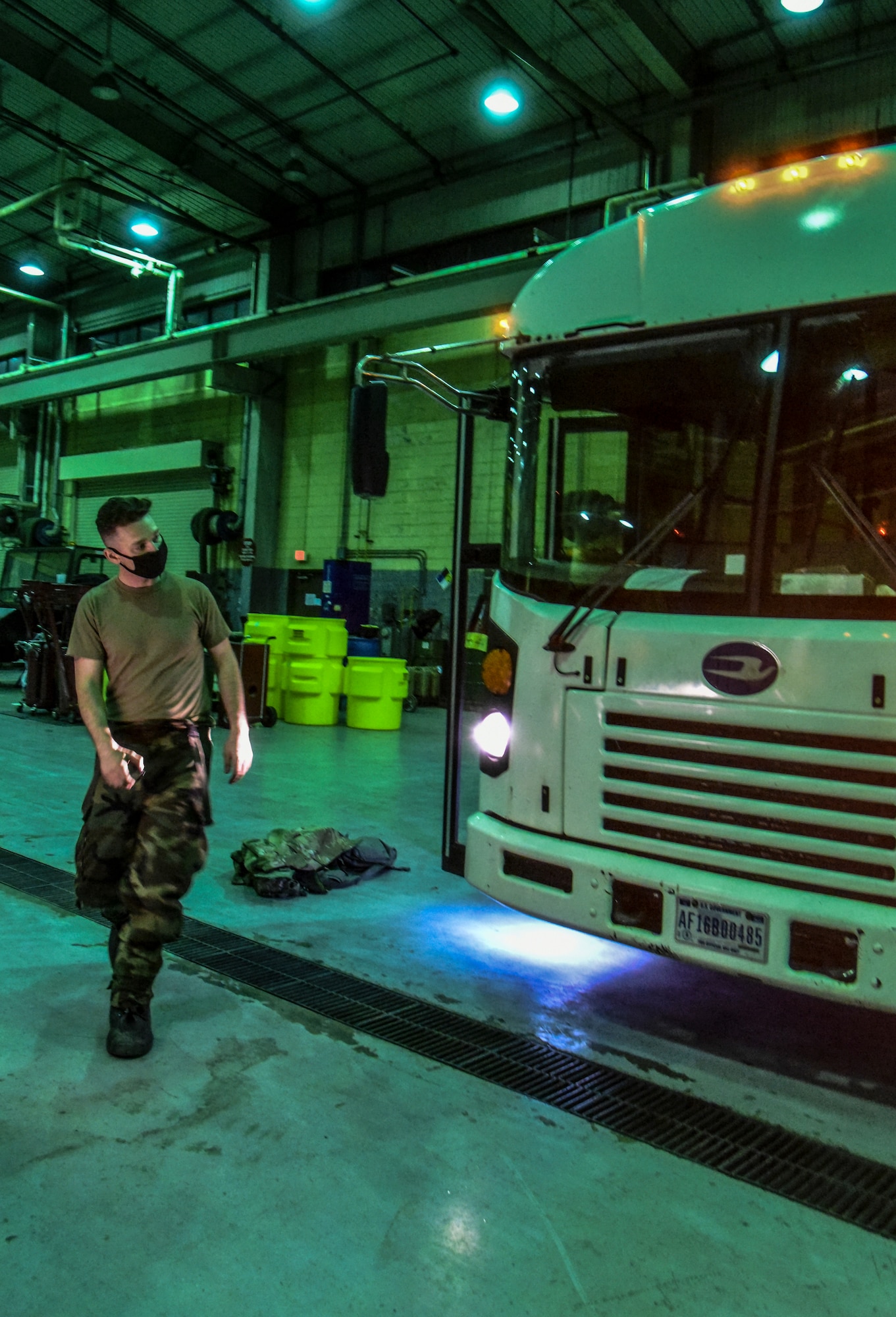 Staff Sgt. Ricky Dupris, 8th Logistics Readiness Squadron vehicle maintenance shop supervisor, inspects the lighting and wiring on a bus at Kunsan Air Base, Republic of Korea, March 23, 2021.  The 8th LRS vehicle maintenance flight maintains and repairs a fleet of more than 500 vehicles, ensuring the Wolf Pack can stay on the move. (U.S. Air Force photo by Tech. Sgt. Kristin S. High)