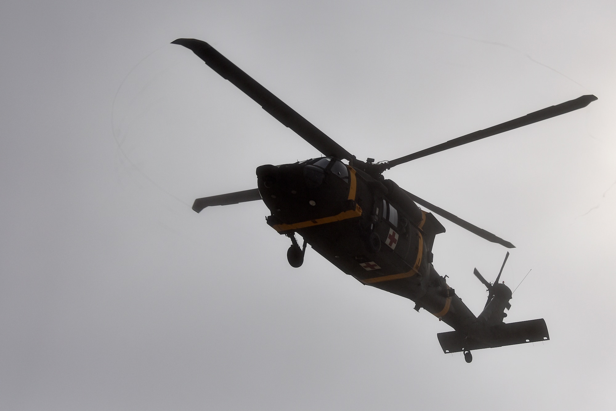 A U.S. Army HH-60M Black Hawk helicopter hovers over the flightline at Kunsan Air Base, Republic of Korea, March 25, 2021. The interagency training involved the 8th Medical Group “Med Hawks” and the 3-2 General Support Aviation Battalion from Camp Humphreys. (U.S. Air Force photo by Senior Airman Suzie Plotnikov)