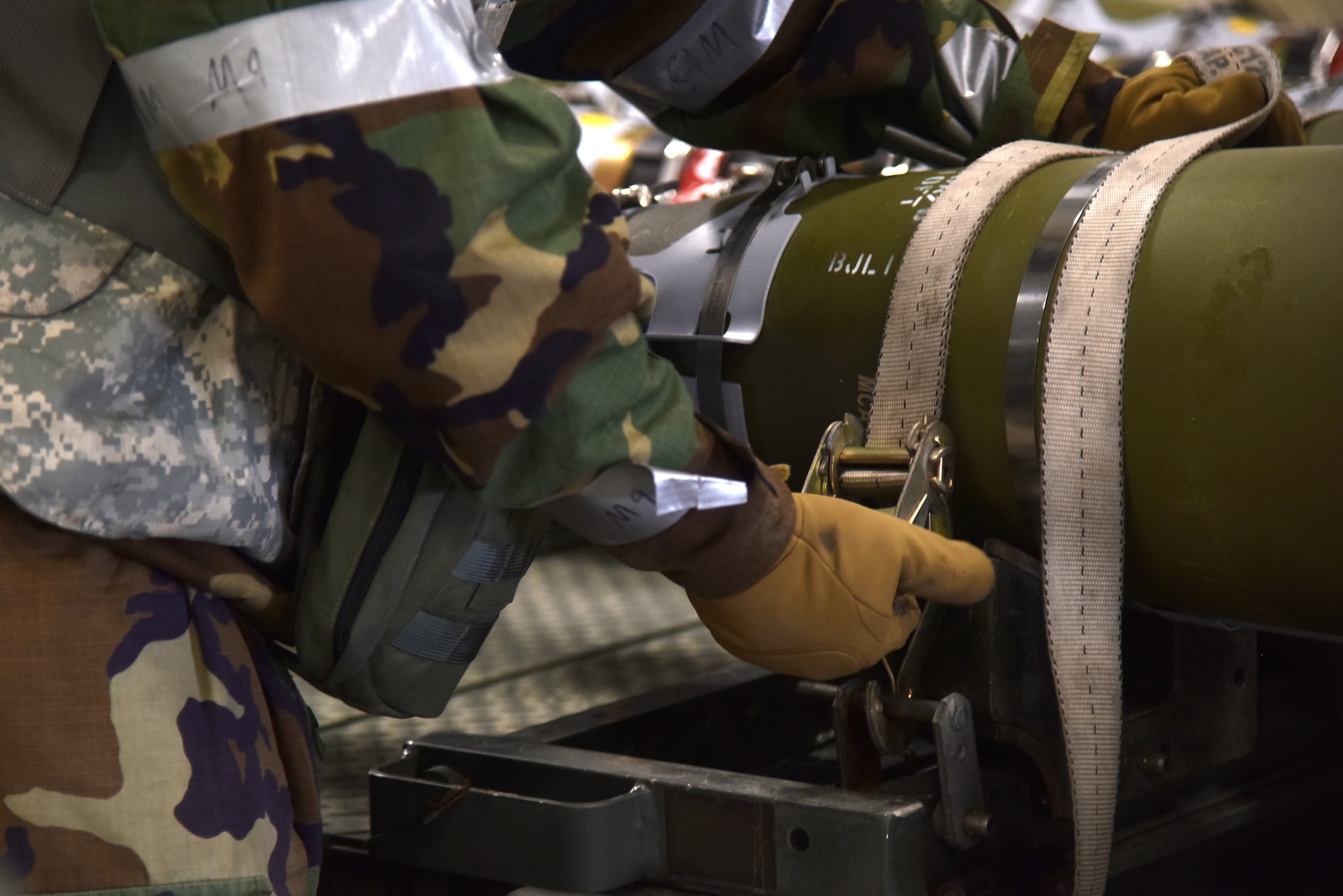 Staff Sgt. Chase Wood, 8th Maintenance Squadron munitions inspector, secures munitions to a trailer during a routine training event at Kunsan Air Base, Republic of Korea, March 24, 2021. The 8th MXS “Dragons” build and maintain munitions for the 8th Fighter Wing. (U.S. Air Force photo by Senior Airman Suzie Plotnikov)