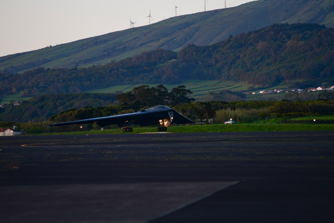 A B-2 Spirit stealth bomber, assigned to Whiteman Air Force Base, Missouri, departs Lajes Field, Azores, March 25, 2021. The strategic bomber missions provide Airmen an opportunity to test their rapid response capability, allowing them to meet any potential crisis or challenge across the globe. (U.S. Air Force photo by Tech. Sgt. Heather Salazar)