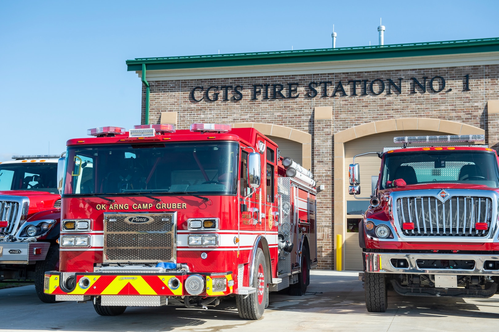 Fire trucks assigned to the newly opened Fire Station Number 1 sit parked outside the station prior to a ribbon cutting at Camp Gruber Training Center, March 24, 2021. (Oklahoma Army National Guard photo by Anthony Jones)