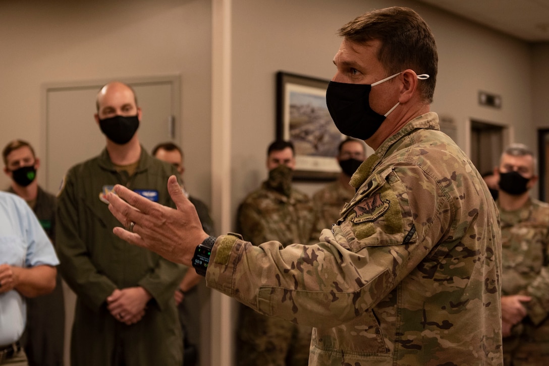 A photo of a U.S Air Force chief sharing a personal story during a ceremony.