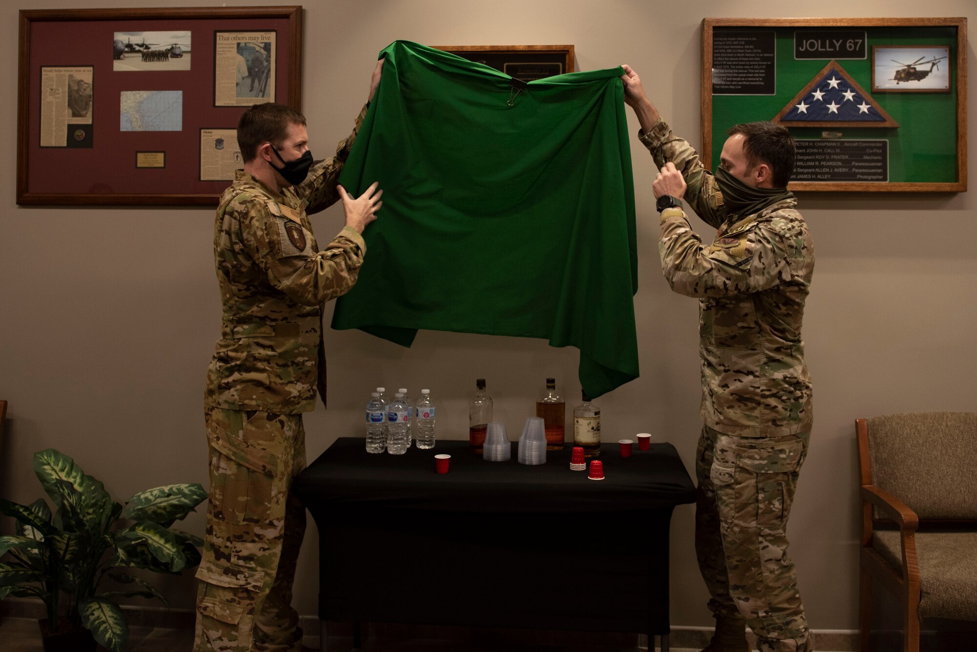 A photo of two U.S. Air Force commanders unveiling a shadowbox.