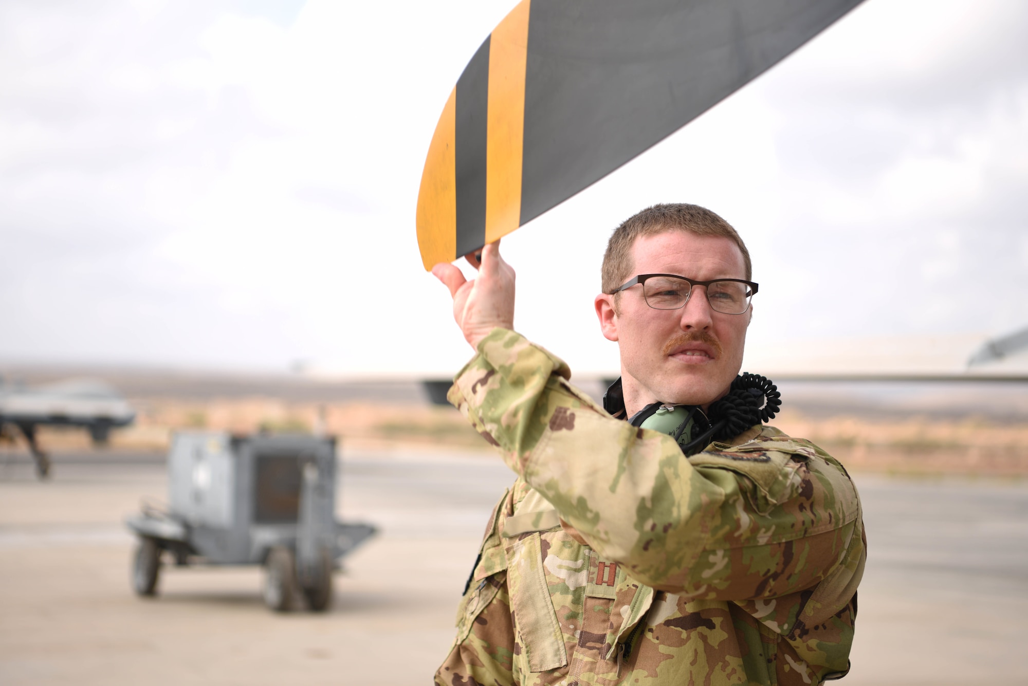 A U.S. Air Force remotely piloted aircraft pilot assigned to the 12th Expeditionary Special Operations Squadron, checks the rotors of a MQ-9 unmanned aviation aircraft at Chabelley Airfield, Djibouti, March 19, 2021. The 12th ESOS provides “eyes in the sky” to U.S. Africa Command’s key mission partners, delivering vital intelligence, surveillance and reconnaissance on enemy movement in the Combined Joint Task Force-Horn of Africa’s area of responsibility. (U.S. Air Force phot by Staff Sgt. Matthew J. Wisher)