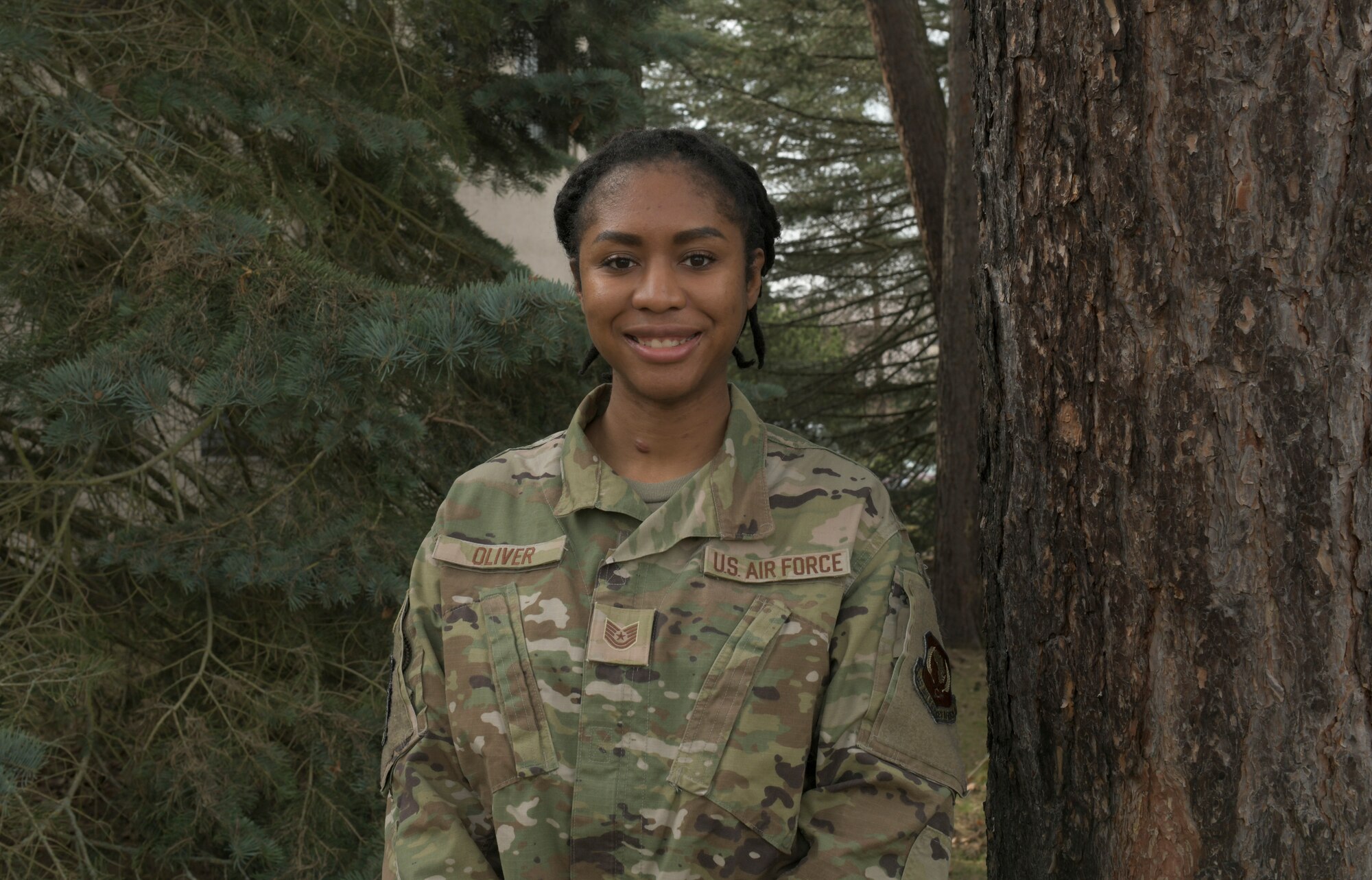 U.S. Air Force Tech. Sgt. Jada Oliver, 435th Air Expeditionary Wing personnel support for contingency operations team member, poses for a photo at Ramstein Air Base, Germany, March 23, 2021. Oliver’s main job duties with PERSCO entail maintaining accountability for members in transit. Some additional duties she has taken on while deployed include tracking members that arrive to Ramstein for medical purposes, and handling most of the Deliberate and Crisis Action Planning and Execution Segments operations involving movement. A personal goal for Oliver is to become a school counselor, while her military goals are to inspire others and to be dependable no matter what rank or position she is given. (U.S. Air Force photo by Senior Airman Gabrielle Winn)