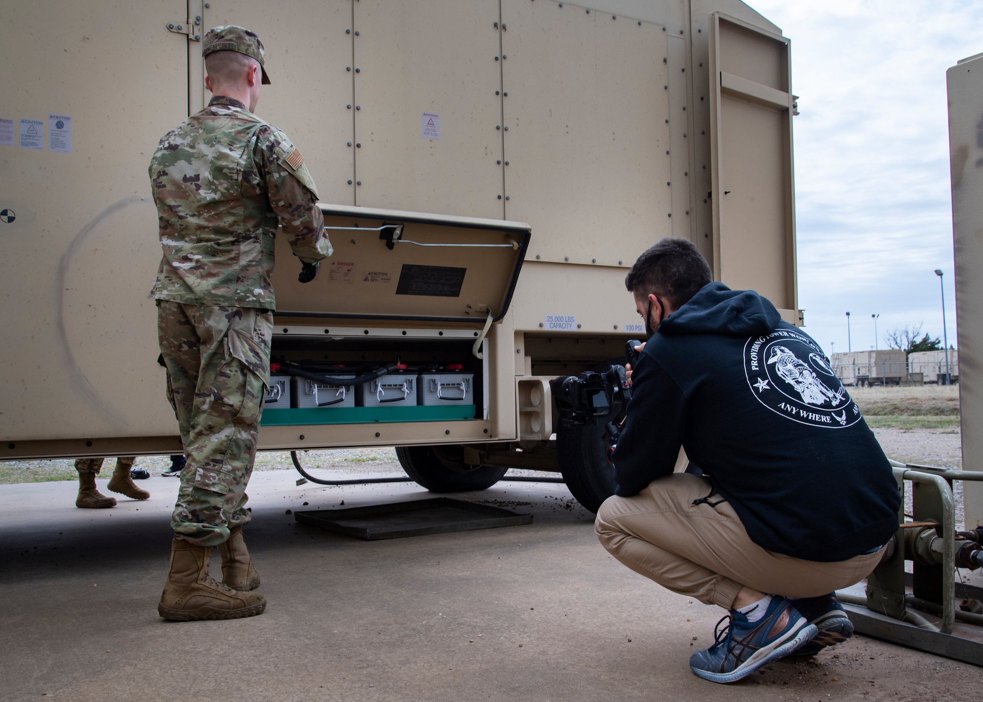 Matthew Reichman, IBM CTR Team CETM Co-Lead, films Senior Airman Logan Krell, 316th Civil Engineering Squadron electrical power production specialist, at Sheppard Air Force Base, Texas, March, 24, 2021. The electrical power production career field is modernizing their career development courses. Reichman and his team traveled to multiple bases to cover every facet of the power pro CDCs, which will be cut up into singular modules for easier viewing. (U.S. Air Force photo by Senior Airman Pedro Tenorio)