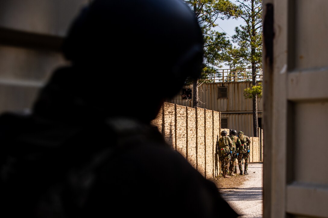 Dutch Marines patrol a street during force-on-force Military Operations on Urbanized Terrain training on Camp Lejeune, N.C., March 10.