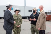 Acting Secretary of the Navy Thomas W. Harker stops at Dry Dock 4 during his visit to Norfolk Naval Shipyard March 17. Dry Dock 4 is undergoing a $200 million renovation spanning nearly three years as part of the Shipyard Infrastructure Optimization Program (SIOP) modernizing the nation’s public shipyards. Secretary Harker toured NNSY as part of a visit to the Mid-Atlantic region.