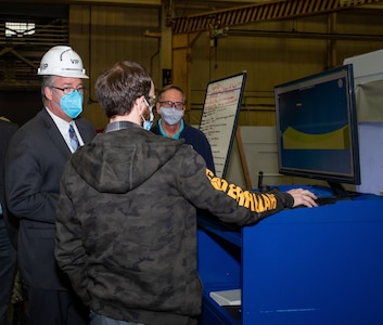 Acting Secretary of the Navy Thomas W. Harker visits the Production Machine Shop during his tour of Norfolk Naval Shipyard March 17. Secretary Harker toured NNSY as part of a visit to the Mid-Atlantic region.