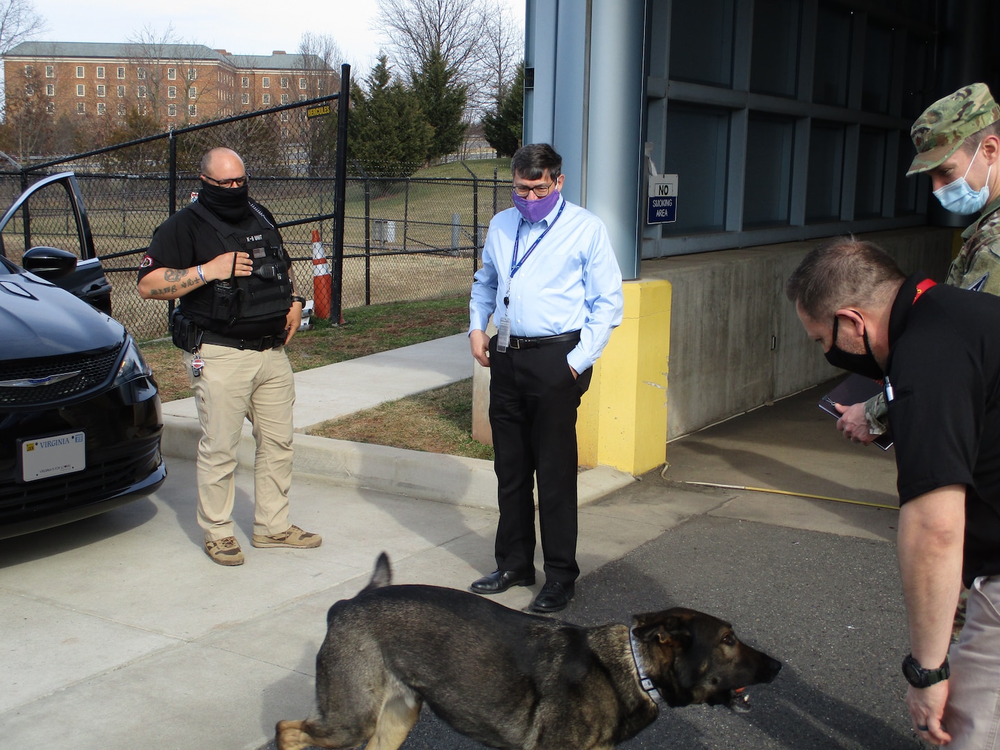 (U) Director Scolese plays with Max, one of SOD’s two canine inspectors.