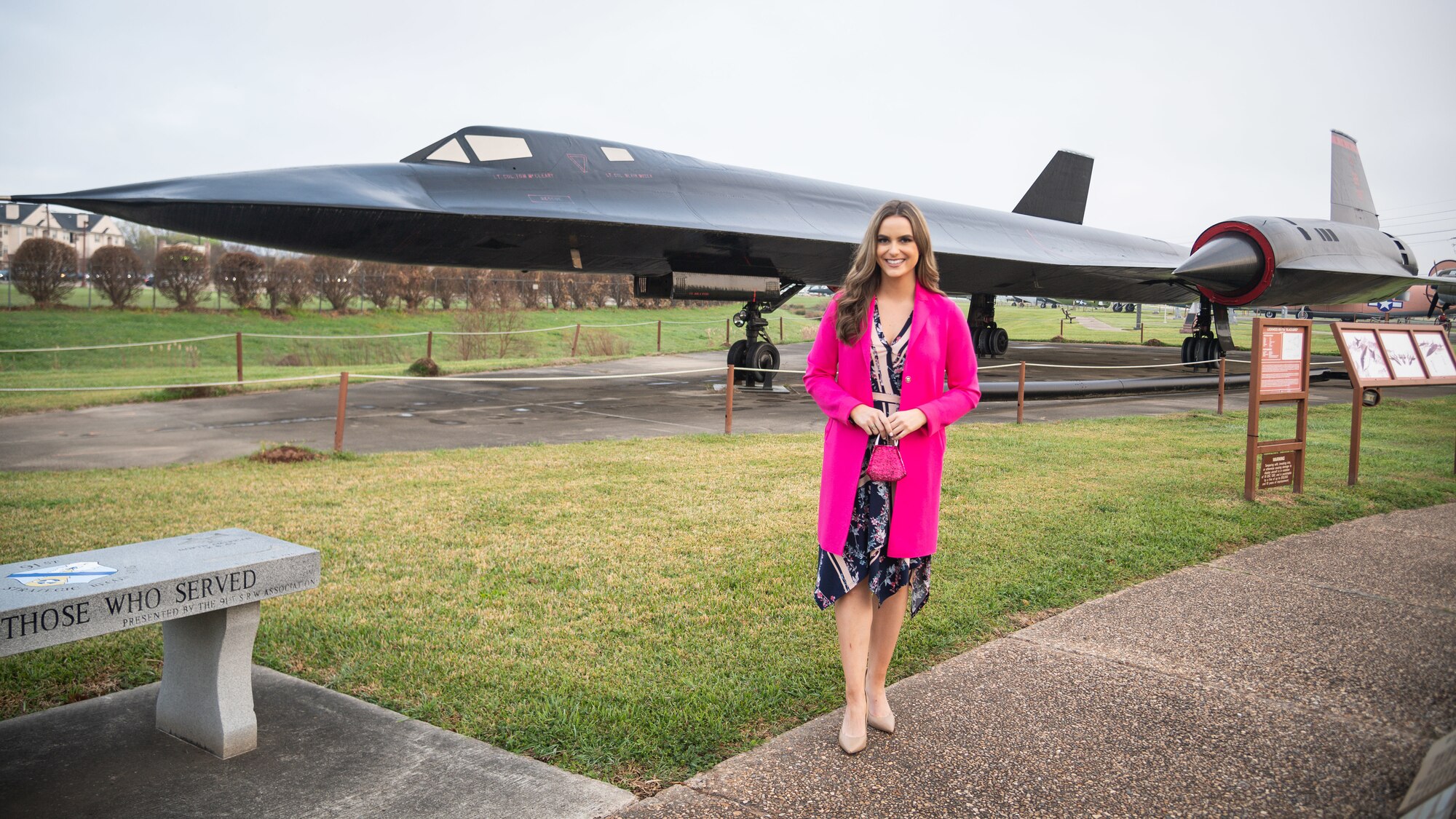 Camille Schrier, Miss America 2020, poses for a photo in front of an SR-71 Blackbird static display at the Global Power Museum at Barksdale Air Force Base, Louisiana, March 24, 2021.