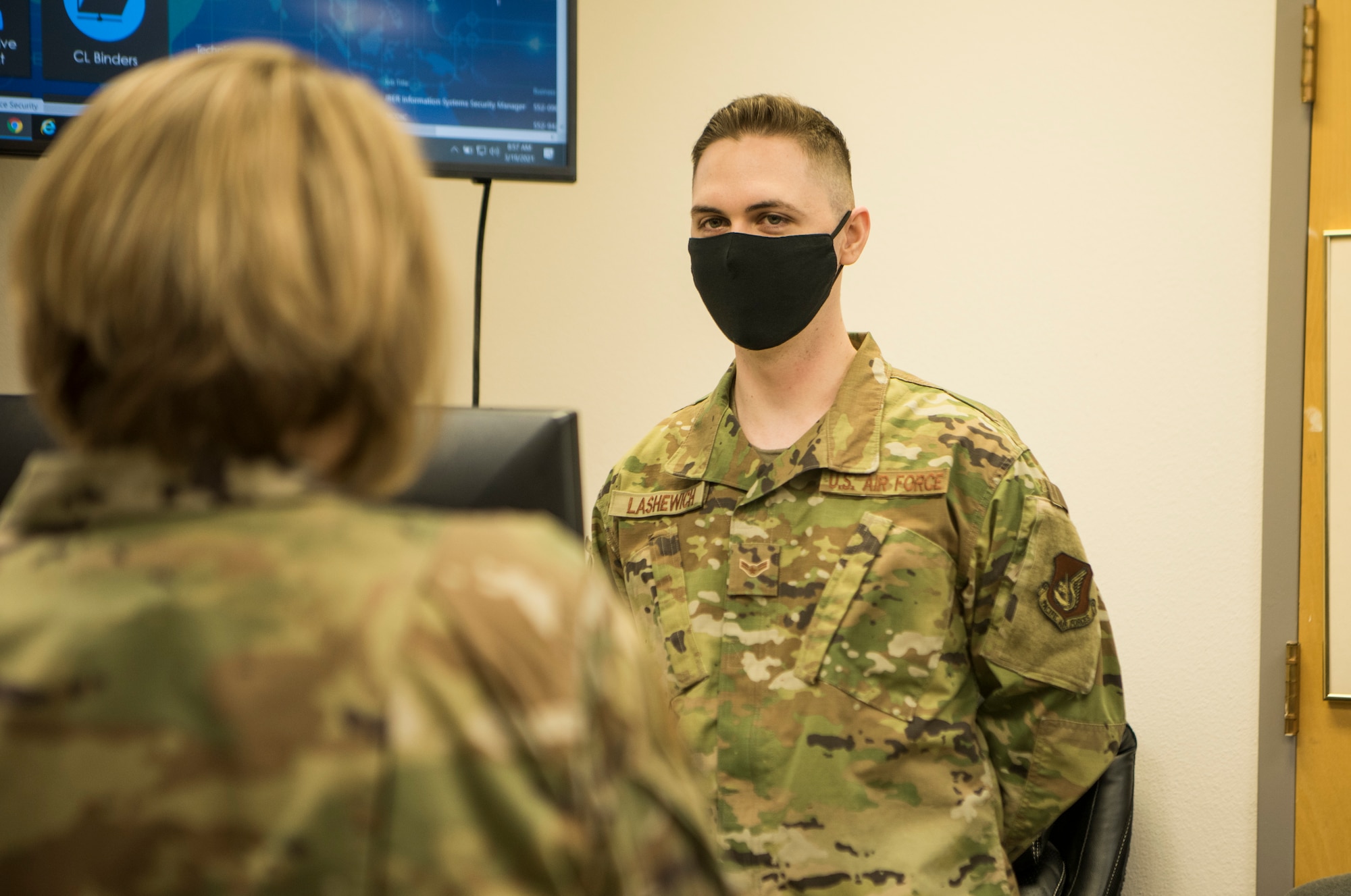 U.S. Air Force Airman 1st Class Austin Lashewich, a 673d Communications Squadron cyber security technician, briefs U.S. Air Force Col. Kirsten Aguilar, Joint Base Elmendorf-Richardson and 673d Air Base Wing commander during an immersion tour at JBER, Alaska, March 19, 2021. The focus of Aguilar’s tour was to get to know the 673d CS Airmen and familiarize herself with the squadron’s different sections and each one’s role in supporting the base.