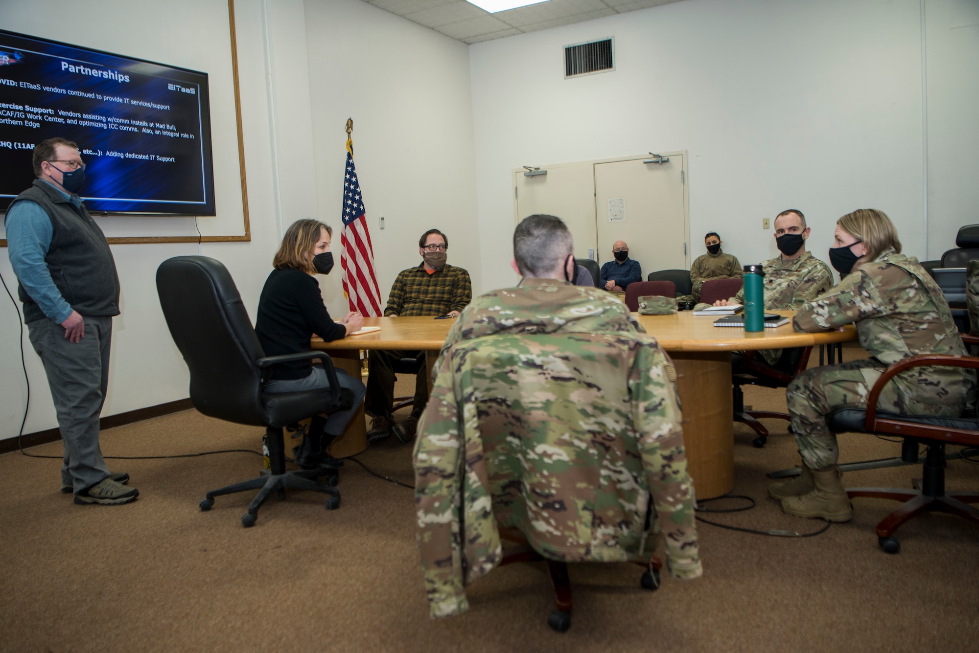 Personnel assigned to the 673d Communications Squadron brief U.S. Air Force Col. Kirsten Aguilar, Joint Base Elmendorf-Richardson and 673d Air Base Wing commander during an immersion tour at JBER, Alaska, March 19, 2021. The focus of Aguilar’s tour was to get to know the 673d CS Airmen and familiarize herself with the squadron’s different sections and each one’s role in supporting the base.