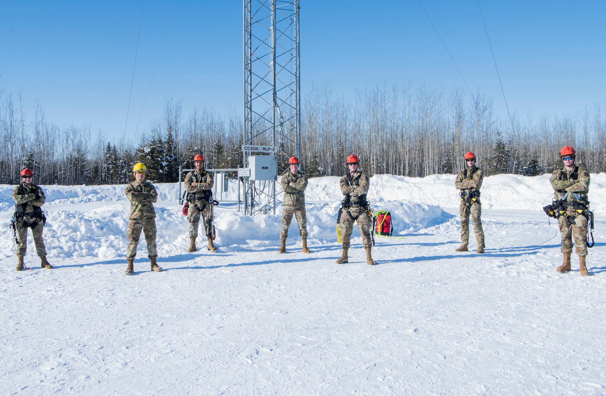 Joint Base Elmendorf-Richardson leadership and 673d Communications Squadron personnel pause for a photograph during an immersion tour at JBER, Alaska, March 19, 2021. The tour focused on the 673d CS Airmen and their role supporting JBER’s mission.