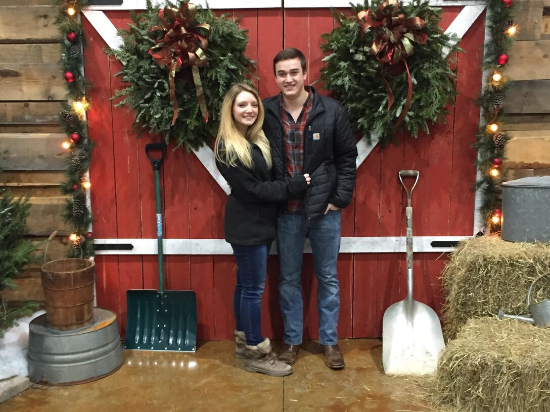 David (right) and Brianna (left) Whitehead pose in front of a barn at a Christmas market in Marietta, Ga. (U.S. Marine Corps courtesy photo)