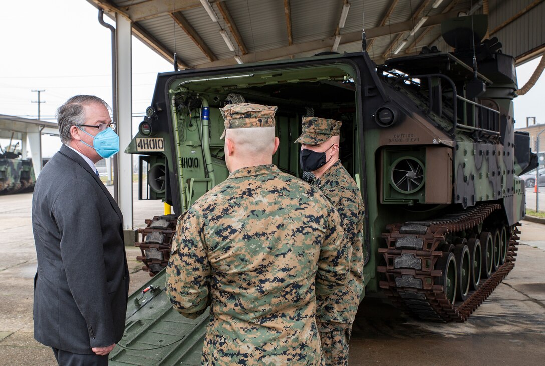 The Honorable Thomas W. Harker, Secretary of the Navy (Acting) speaks with U.S. Marine Corps Brig. Gen. William Souza, Deputy Commander, Mobilization, Fleet Marine Force Atlantic, U.S. Marine Corps Forces Command, and U.S. Marine Corps Forces Northern Command and Maj. Javier Sagura, Inspector & Instructor for Alpha Company 4th Assault Amphibian Battalion about the Assault Amphibious Vehicle on Joint Expeditionary Base Little Creek-Fort Story in Virginia Beach, Virginia, February 17, 2021. Secretary Harker visited various commands across the Mid-Atlantic region to meet with Sailors and Marines. (U.S. Marine Corps Photo by Mr. Jonathan Donnelly/Released)