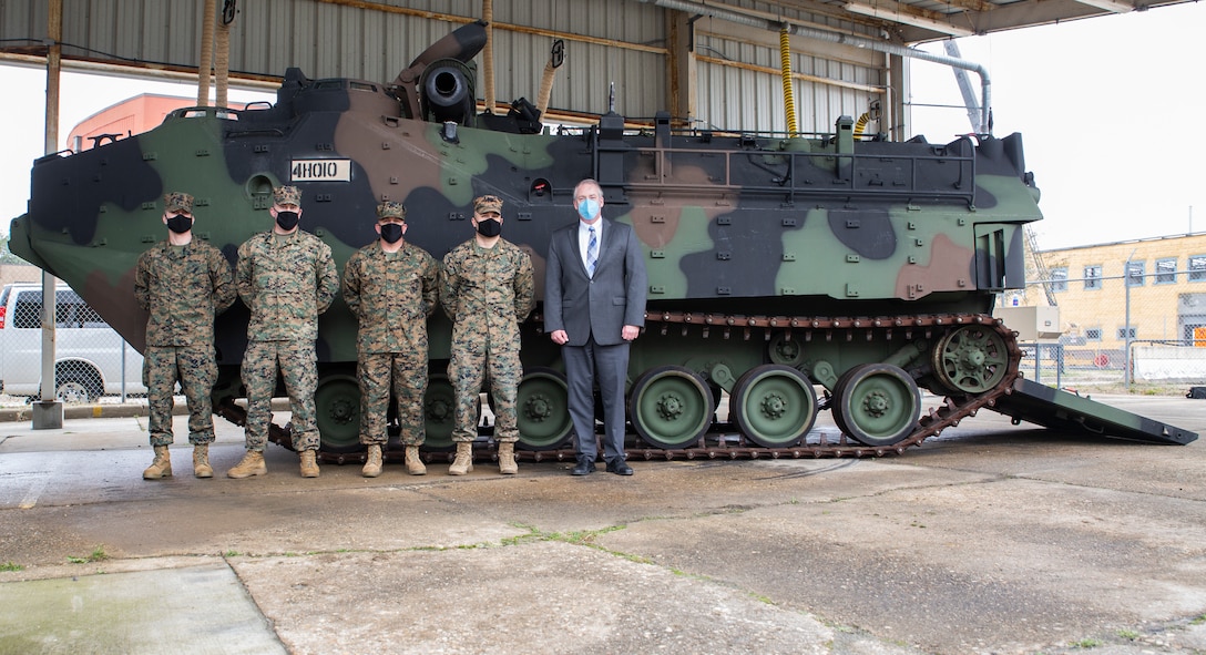The Honorable Thomas W. Harker, Secretary of the Navy (Acting) poses for a photo with U.S. Marines in front of an Assault Amphibious Vehicle of Alpha Company 4th Assault Amphibian Battalion on Joint Expeditionary Base Little Creek-Fort Story in Virginia Beach, Virginia, February 17, 2021. Secretary Harker visited various commands across the Mid-Atlantic region to meet with Sailors and Marines. (U.S. Marine Corps Photo by Mr. Jonathan Donnelly/Released)