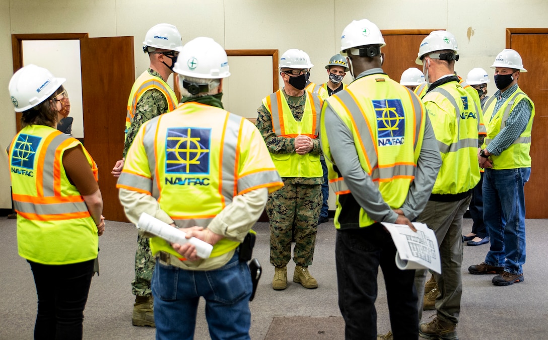 U.S. Marine Corps Lt. Gen. Robert F. Hedelund, Commanding General, Fleet Marine Force Atlantic, and Commander, U.S. Marine Corps Forces Command, U.S. Marine Corps Forces Northern Command speaks with members of Navy Facilities Engineering Systems Command (NAVFAC) Mid-Atlantic and Heritage Contracting in the Marine Camp Elmore (MCE-9) building at Camp Elmore in Norfolk, Virginia, March 24, 2021. This meeting signifies the start of converting previously used training rooms, classrooms, and administrative offices into fully-functioning, mission-capable headquarters spaces in support of the Commandant’s force restructure initiatives. The interior reconfiguration will accommodate the new P&O, South detachment. The upgraded administrative workspaces will be occupied by personnel assigned to manpower, reserve integration, plans, forward-deployed plans and execution, global force analysis, aviation force analysis, and readiness functions. The renovation is slated to be complete in August of 2021. (U.S. Marine Corps Photo by Mr. Jonathan Donnelly/Released)