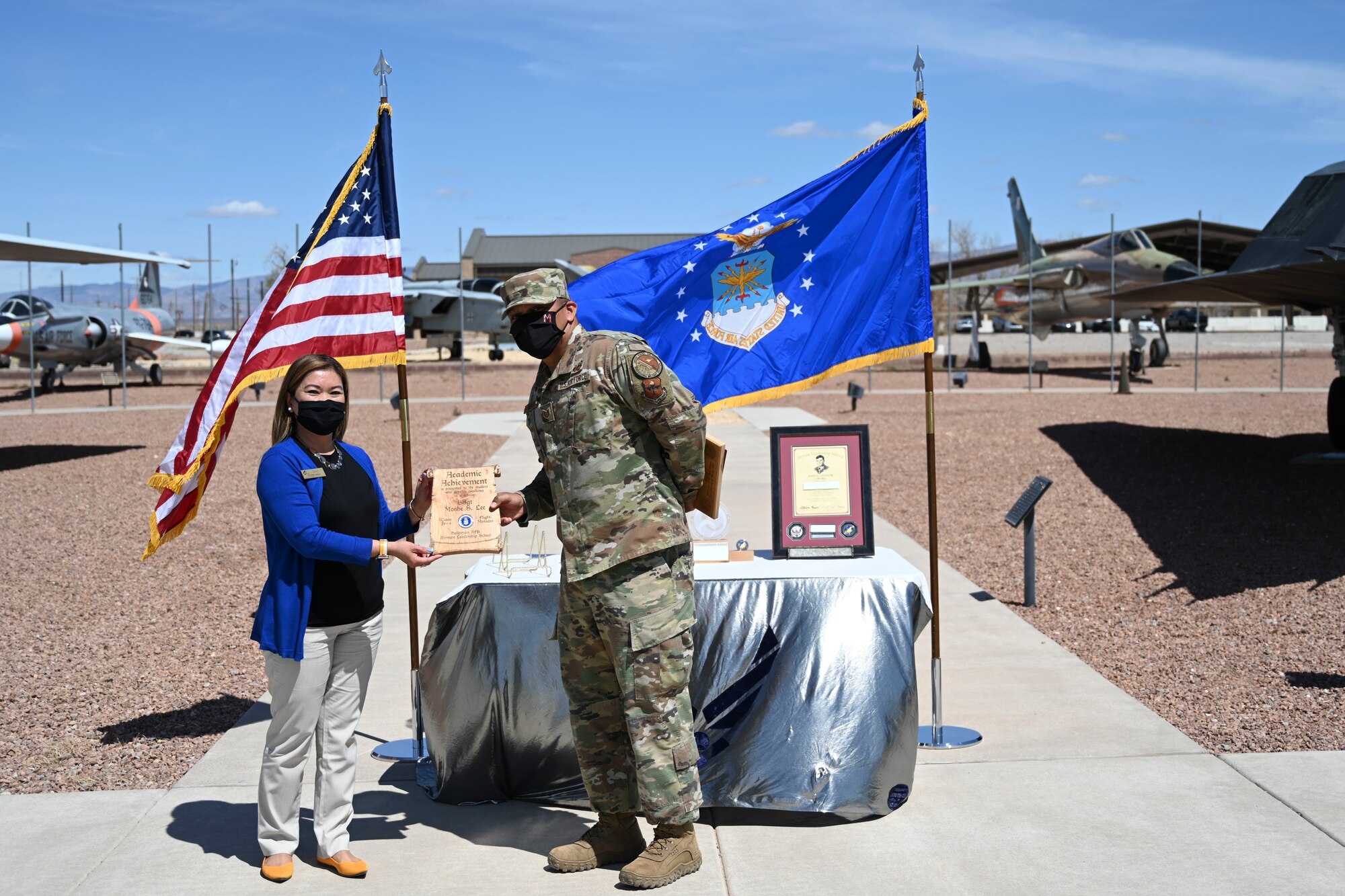 An Airman receives an award during the 21-4 ALS graduation ceremony.