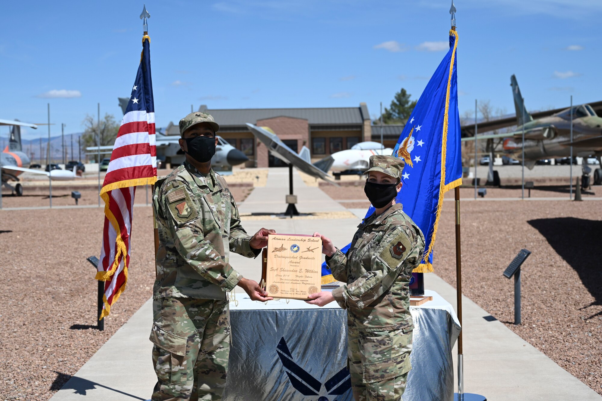 An Airman receives an award during the 21-4 ALS graduation ceremony.