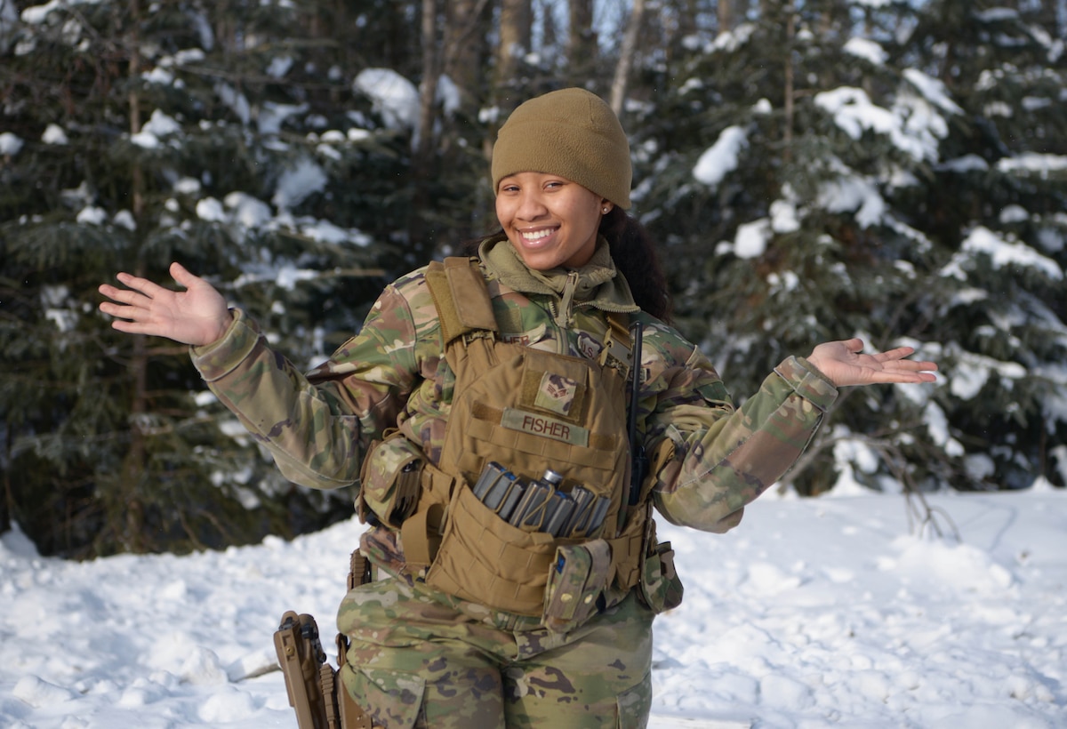 U.S. Air Force Senior Airman Heaven Fisher, a 354th Security Forces Squadron response force leader, poses for a photo March 16, 2021, on Eielson Air Force Base Alaska. Fisher is a single parent and utilizes various childcare programs in order to serve in the Air Force without worrying about her child's well-being. (U.S. Air Force photo by Senior Airman Beaux Hebert)
