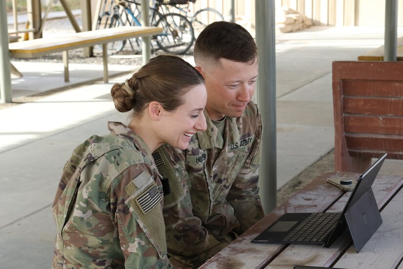 Cpl. Ashley Hibbler, left, and Spc. Kyle Hibbler, deployed with Delta Company, 2-104th General Support Aviation Battalion, 28th Expeditionary Combat Aviation Brigade, video chat with their son Landon from an airfield in the 28th ECAB’s area of operations in the Middle East.
