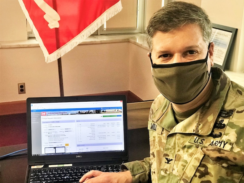 Memphis District Commander Col. Zachary Miller signs the first SPOT Report using the new Smart Project Updates Dashboard.
