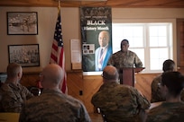 U.S. Air Force Technical Sgt. Kirby Addison opens a luncheon with a few words at the Vermont Air National Guard base Feb. 14, 2019. The Cultural Diversity Enhancement Team of the Vermont National Guard hosted a soulful luncheon and discussion for Airmen and Soldiers with a focus on Black History Month and included a guest speaker. (U.S. Air National Guard photo by 2nd Lt. Chelsea Clark)