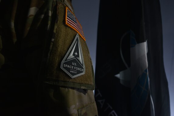 U.S. Space Force 2nd Lieutenant Jeff Martin, 315th Training Squadron student, wears the Space Force patch at Angelo State University’s Planetarium in San Angelo, Texas, March 26, 2021. The Space Force is a military service that organizes, trains, and equips space forces in order to protect U.S. and allied interests in space and to provide space capabilities to the joint force. (U.S. Air Force photo by Senior Airman Ashley Thrash)