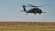 A man prepares to repel from a helicopter