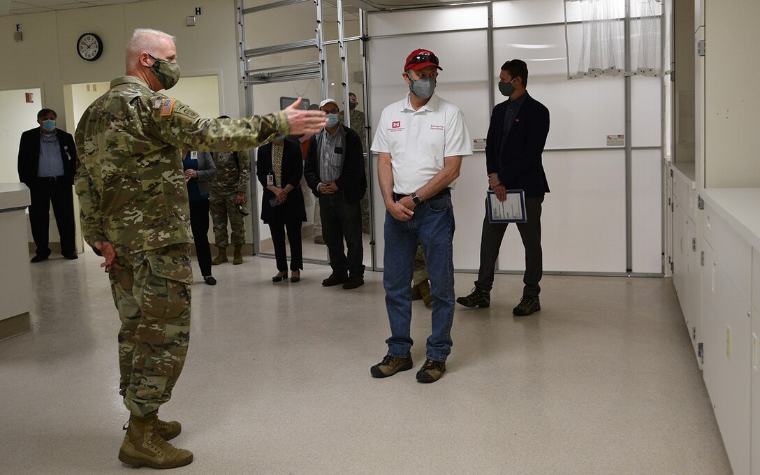 Brig. Gen. Paul Owen, commander of the U.S. Army Corps of Engineers South Pacific Division, left, asks a question about an oxygen feature on the wall of the day care area during a March 19 project site tour at Beverly Community Hospital in Montebello, California. The Corps and its contractors converted the hospital’s west wing into a 17-room, NON-COVID patient area and the hospital’s day care waiting room into a COVID patient staging area, by adding high-flow oxygen and converting the area to negative pressure. The final inspection of the construction work at the hospital was completed earlier that morning.