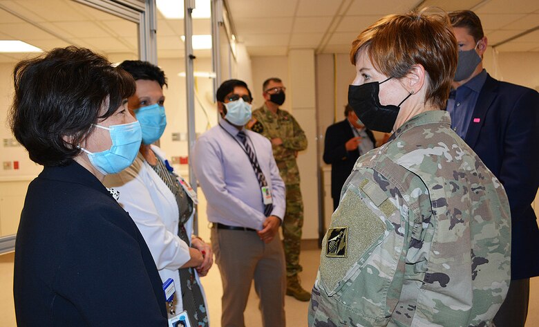 Col. Julie Balten, commander of the U.S. Army Corps of Engineers Los Angeles District, right, talks to Alice Cheng, president and CEO of Beverly Community Hospital, left, during a March 19 project site tour of the hospital in Montebello, California. The Corps and its contractors converted the hospital’s west wing into a 17-room, NON-COVID patient area and the hospital’s day care waiting room into a COVID patient staging area, by adding high-flow oxygen and converting the area to negative pressure. The final inspection of the construction work at the hospital was completed earlier that morning.