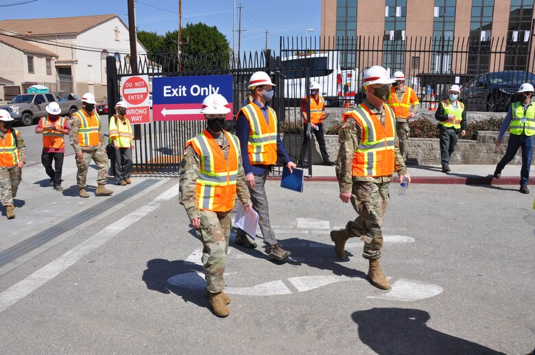 Col. Julie Balten, commander of the U.S. Army Corps of Engineers Los Angeles District, left; David Van Dorpe, deputy district engineer for the Corps’ LA District, center; and Brig. Gen. Paul Owen, commander of the Corps’ South Pacific Division, right, arrive at Adventist Health White Memorial Medical Center March 19 to view construction progress on an alternate care facility the Corps and its contractors built in support of FEMA and in coordination with the State of California in its response to the COVID-19 pandemic.