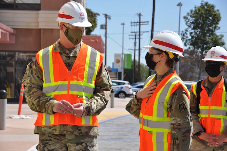 Col. Julie Balten, commander of the U.S. Army Corps of Engineers Los Angeles District, right, and Brig. Gen. Paul Owen, commander of the Corps’ South Pacific Division, left, pause for a quick discussion March 19 after viewing construction progress of the Corps and its contractors work on an alternate care facility at Adventist Health White Memorial Medical Center in the Boyle Heights neighborhood of Los Angeles.