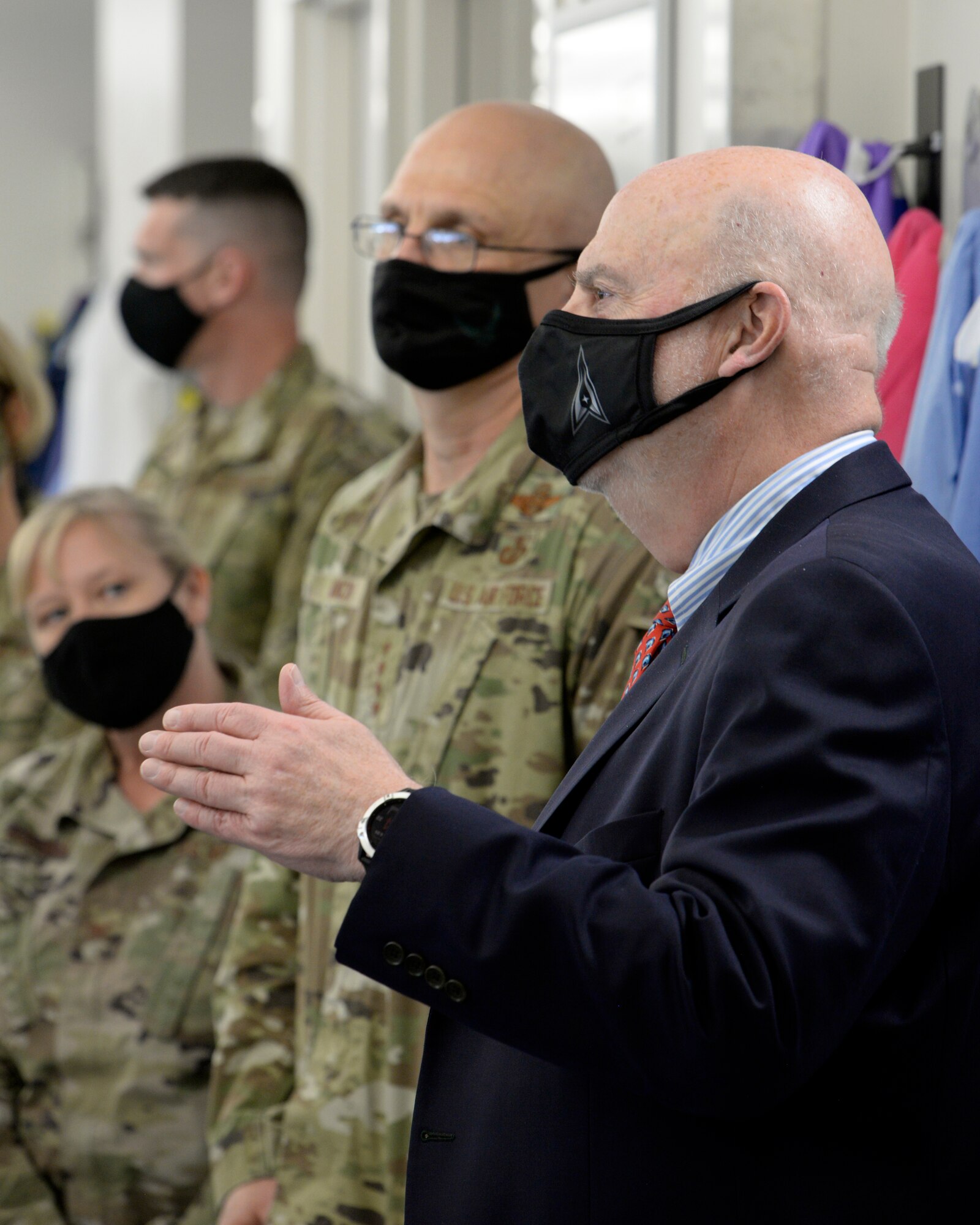 Acting Secretary of the Air Force John Roth, right, and Gen. Arnold W. Bunch Jr., commander, Air Force Materiel Command, listen to a presentation about the U.S. Air Force School of Aerospace Medicine Epidemiology Laboratory at Wright-Patterson Air Force Base, Ohio, March 23, 2021. The lab is responsible for analyzing a majority of the COVID-19 tests in the Air Force. Roth met with Air Force personnel and toured several facilities at the base including the National Air and Space Intelligence Center. (U.S. Air Force photo by Ty Greenlees)