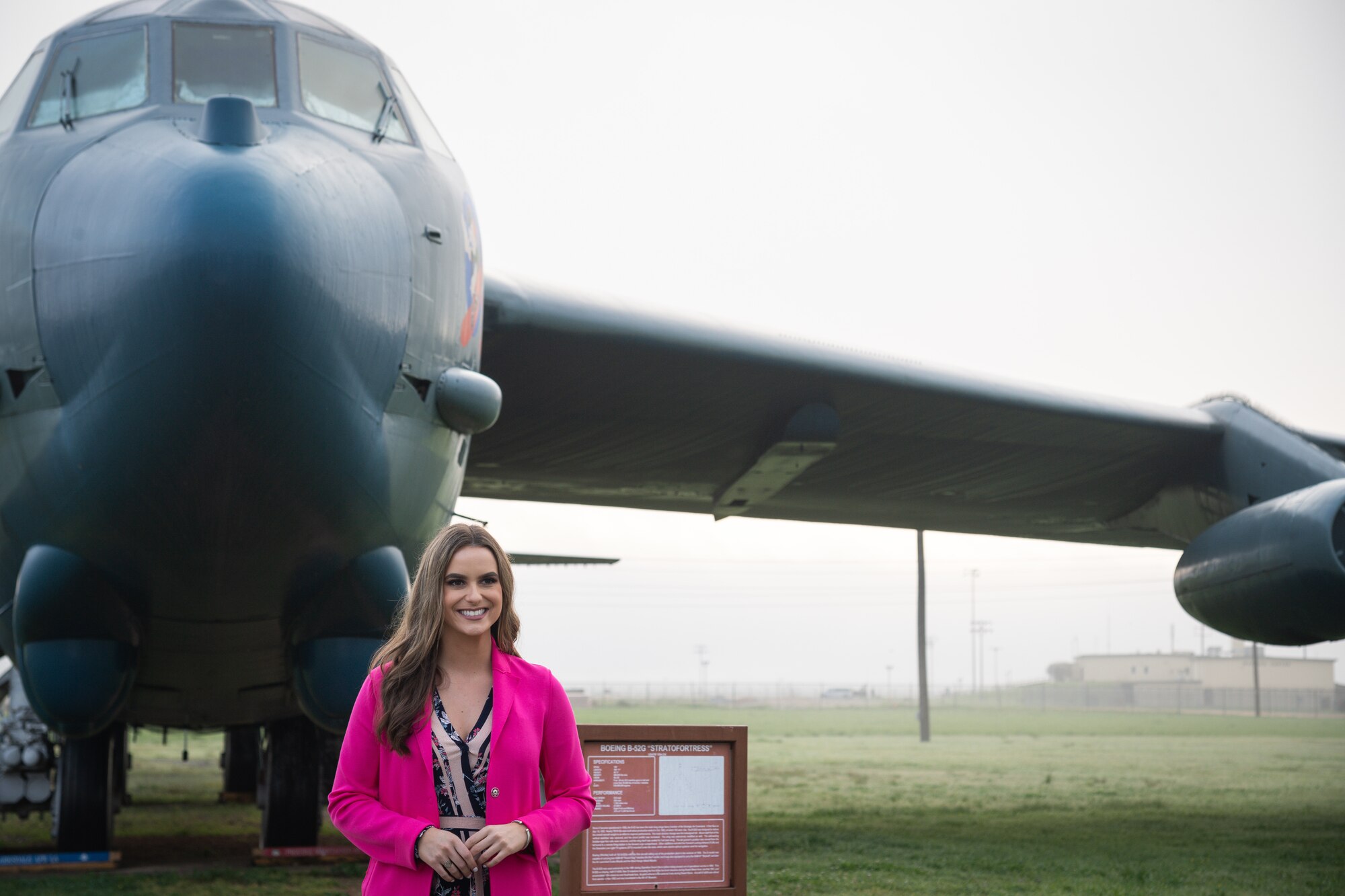Camille Schrier, Miss America 2020, poses for a photo in front of a B-52G Stratofortress static display at the Global Power Museum at Barksdale Air Force Base, Louisiana, March 24, 2021.
