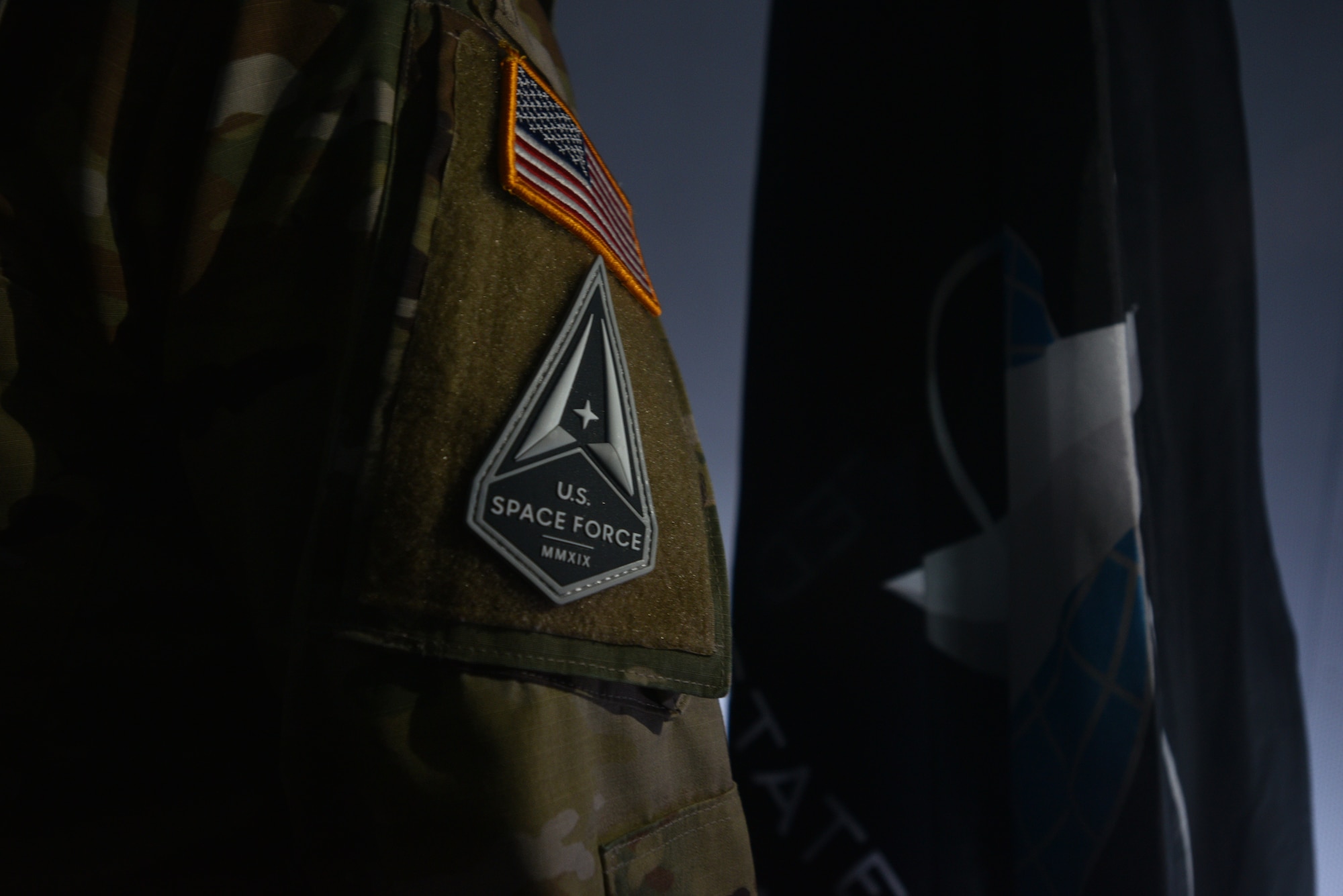U.S. Space Force 2nd Lieutenant Jeff Martin, 315th Training Squadron student, wears the Space Force patch at Angelo State University’s Planetarium in San Angelo, Texas, March 26, 2021. The Space Force is a military service that organizes, trains, and equips space forces in order to protect U.S. and allied interests in space and to provide space capabilities to the joint force. (U.S. Air Force photo by Senior Airman Ashley Thrash)