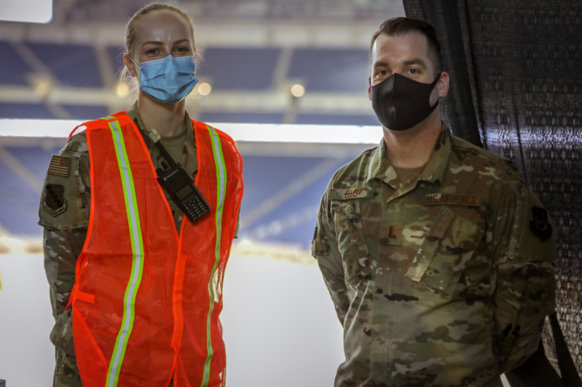 Capt. Victoria Zenyuch,and 2nd Lt. Christopher Ellis, a registered nurse and administration officer from the 66th Medcical Squadron at Hanscom Air Force Base, Mass., pose, during a break at the state-led, federally-supported Ford Field COVID-19 Community Vaccination Center in Detroit, March 24. The 66 MDS deployed a team of medics to Detroit in support of the federal effort to vaccinate up to 6,000 people a day against COVID-19. (U.S. Army photo by Spc. Laurie Ellen Schubert)