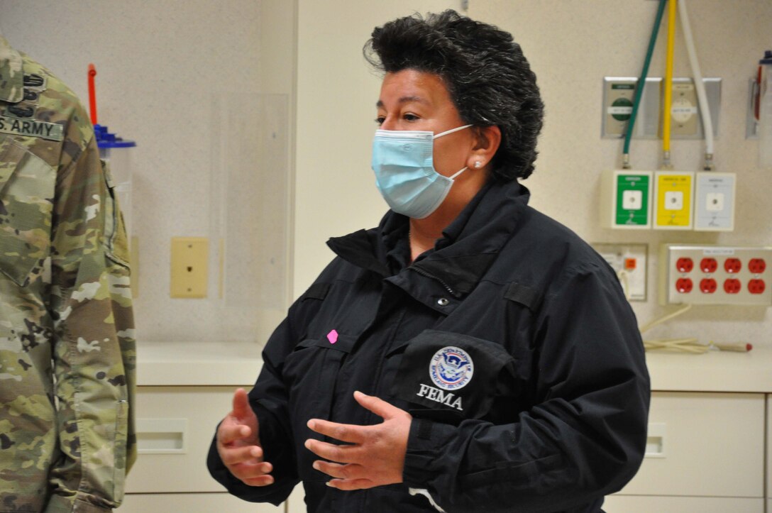Veronica Verde, external affairs officer for FEMA Region IX, U.S. Department of Homeland Security, talks about the partnership with the Corps and other local and state agencies during a March 19 tour of Beverly Community Hospital in Montebello, California. The Corps and its contractors completed the conversion of the hospital’s west wing into a 17-room, NON-COVID patient area and the hospital’s day care waiting room into a COVID patient staging area, by adding high-flow oxygen and converting the area to negative pressure. The final inspection of the construction work at the hospital was completed earlier that morning.
