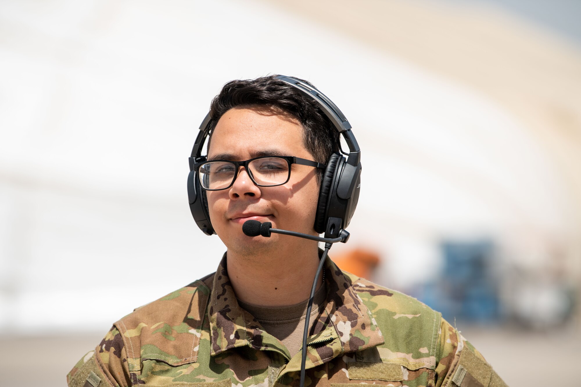 Airman 1st Class John Hess stands on the flight line