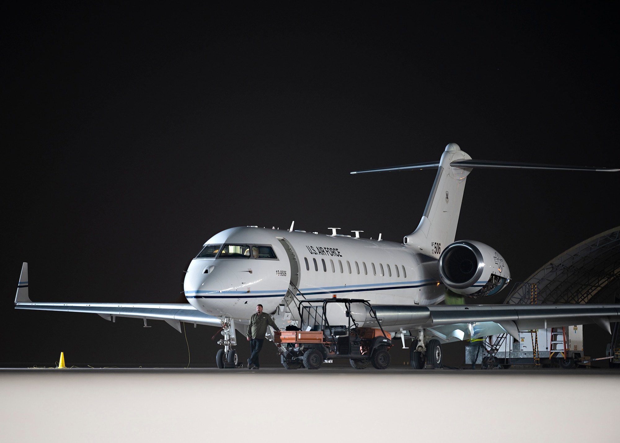 A U.S. Air Force E-11A Battlefield Airborne Communications Node aircraft sits parked.