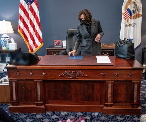 Vice President Kamala Harris conducts business at the USS Constitution desk.