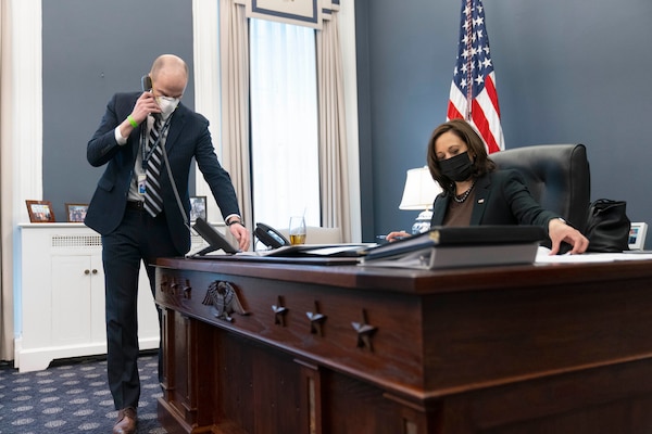 Vice President Kamala Harris conducts business at the USS Constitution desk.