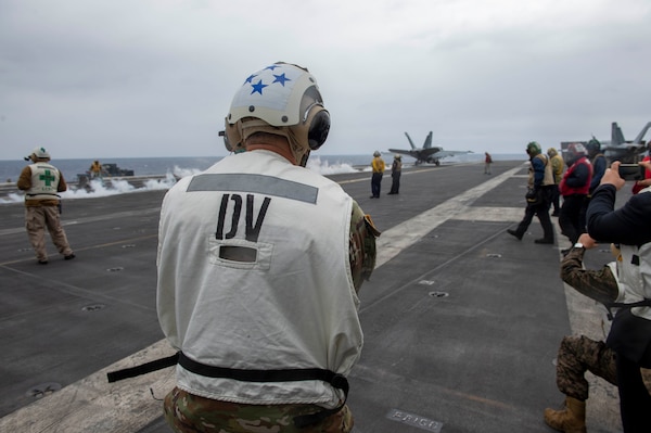 Gen. Stephen Townsend, Commander, United States Africa Command, observes flight operations aboard the Nimitz-class aircraft carrier USS Dwight D. Eisenhower (CVN 69), in the Mediterranean Sea, March 25, 2021.