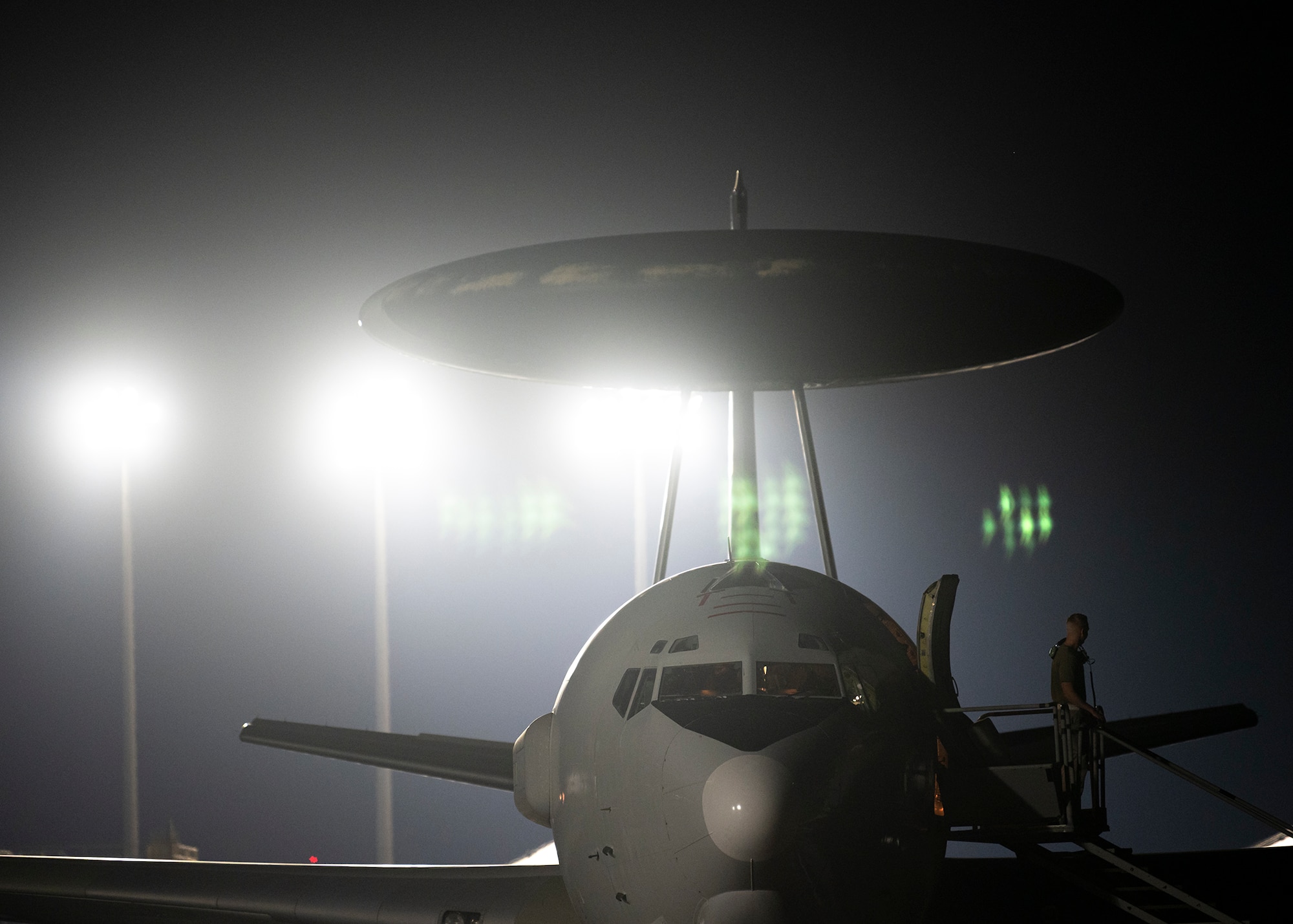 A U.S. Air Force E-3 Sentry sits parked.