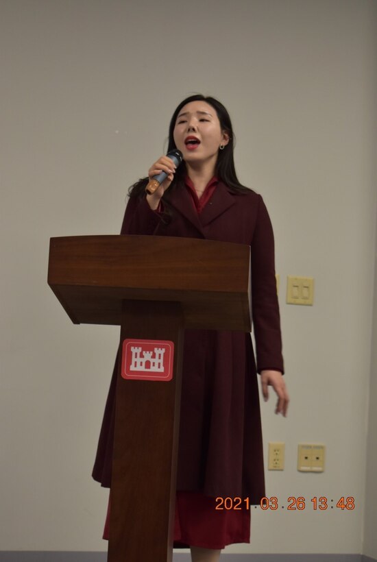 Eman Sundquist, Programs and Project Management Division (PPMD) project manager, speaks to the crowd of attendees about finding her place in a world made for men during the Far East District’s Women’s History Month celebration at District Headquarters, USAG Humphreys, Republic of Korea, Mar. 26, 2021. The event centered on a panel of FED women, who spoke about their experiences as women in the workforce.