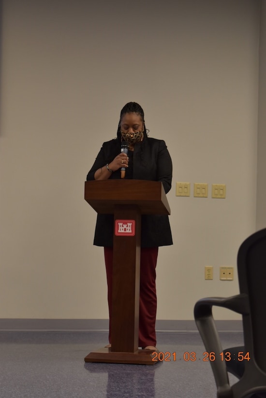 Eman Sundquist, Programs and Project Management Division (PPMD) project manager, speaks to the crowd of attendees about finding her place in a world made for men during the Far East District’s Women’s History Month celebration at District Headquarters, USAG Humphreys, Republic of Korea, Mar. 26, 2021. The event centered on a panel of FED women, who spoke about their experiences as women in the workforce.