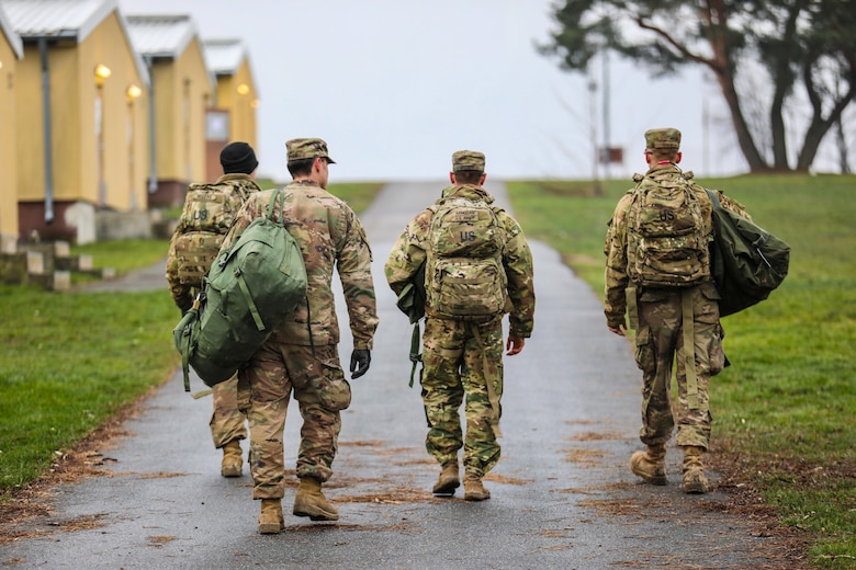 U.S. Army Soldiers from the 91st Brigade Engineer Battalion, 1st Armored Brigade Combat Team, 1st Cavalry Division carry their duffel bags to their temporary barracks at Camp Aachen in Grafenwoehr, Germany, Dec. 19, 2018. This is the last stop of 1-1 CD’s rotation supporting Atlantic Resolve, an exercise to improve the interoperability of U.S. Forces with their NATO allies and partners. Walkability and a proximity to the barracks are important factors in siting the Operational Readiness Training Center in the Grafenwoehr Training Area’s Area Development Execution Plan.