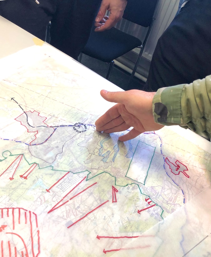 Soldiers and Civilian personnel discuss possible future plans for sections of the Grafenwoehr Training Area during collaboration sessions in spring 2019 that were part of creating an Area Development Execution Plan to outline the long-term plan for the area.