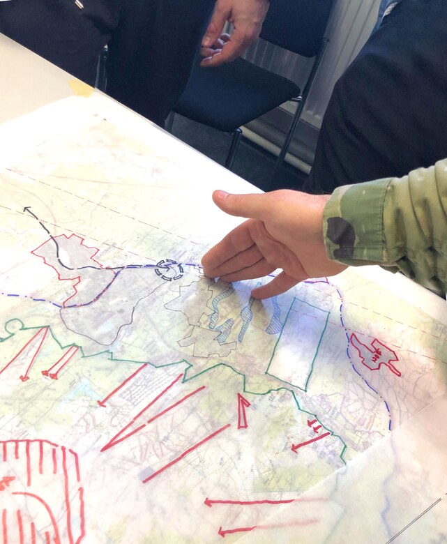 Soldiers and Civilian personnel discuss possible future plans for sections of the Grafenwoehr Training Area during collaboration sessions in spring 2019 that were part of creating an Area Development Execution Plan to outline the long-term plan for the area.